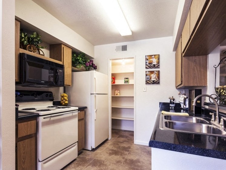 Kitchen (Non-Renovated Apartment) at Presidio North Apartments in Phoenix, AZ